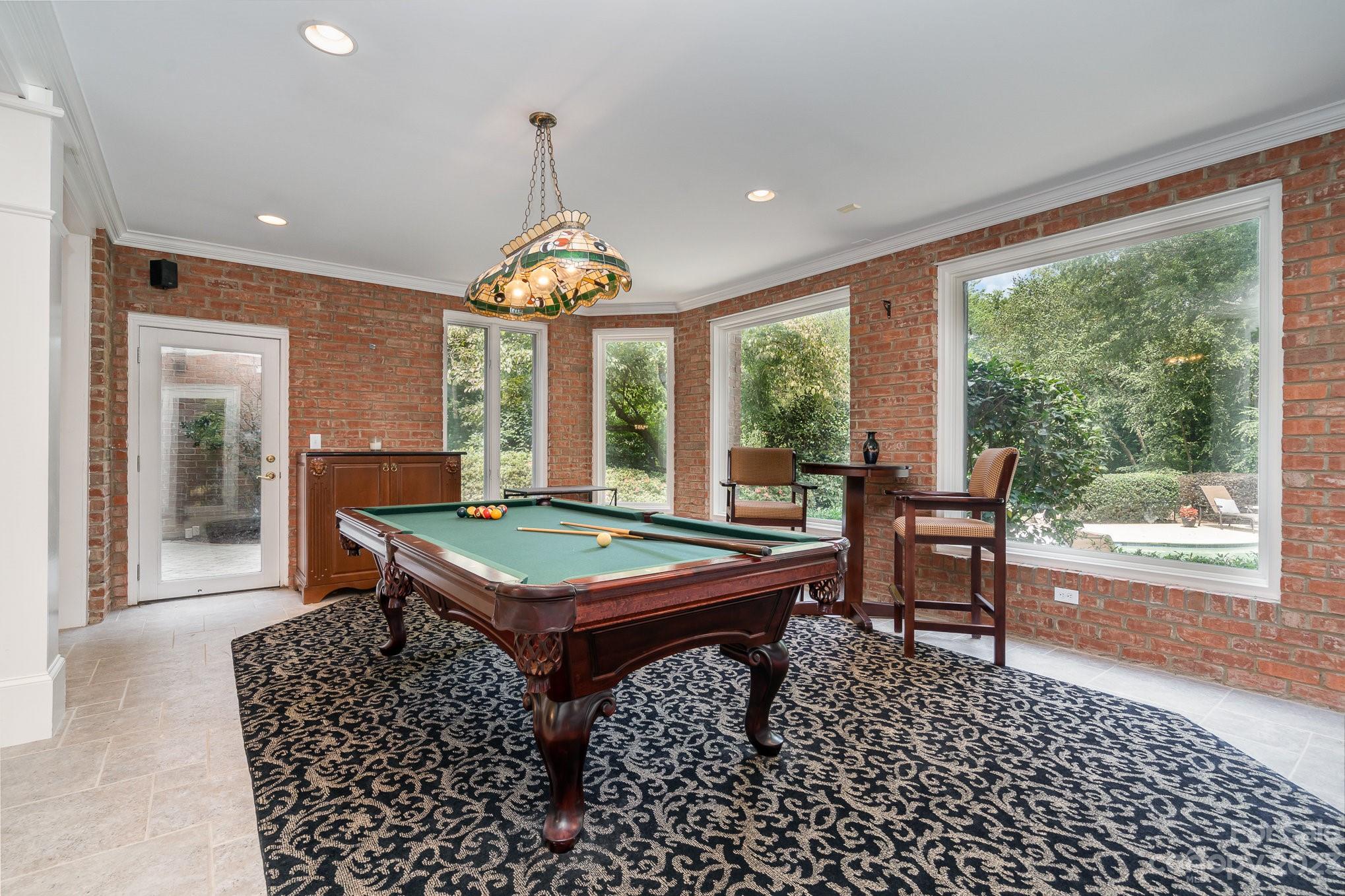 6535 Seton House Lane Charlotte, NC 28277 - Photo 32 of 48 a room with pool table and windows