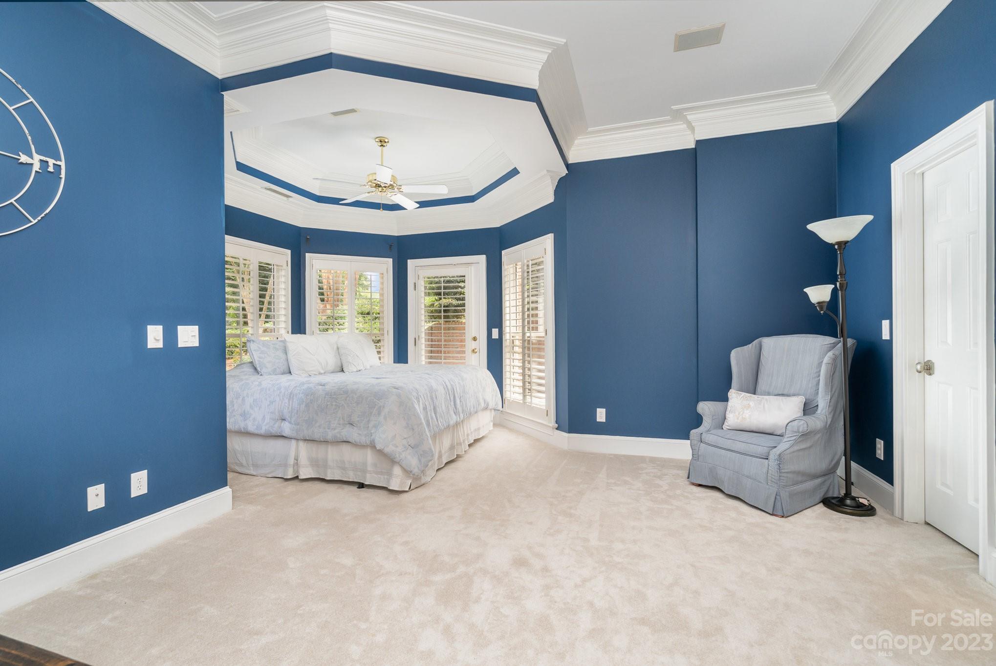 6535 Seton House Lane Charlotte, NC 28277 - Photo 36 of 48 a bedroom with a bed and a chandelier
