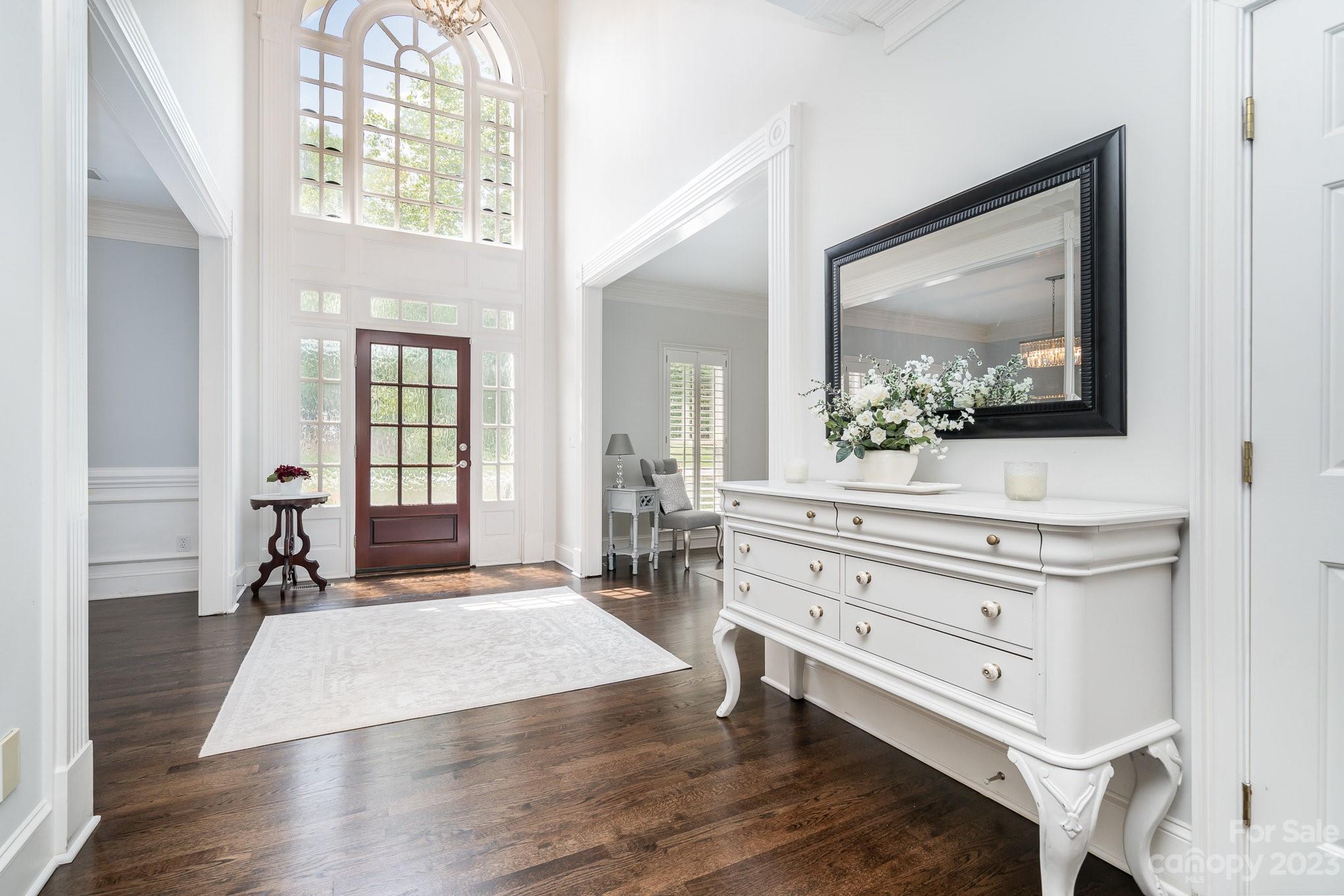 6535 Seton House Lane Charlotte, NC 28277 - Photo 4 of 48 a spacious bedroom with a bed and a mirror on the dresser