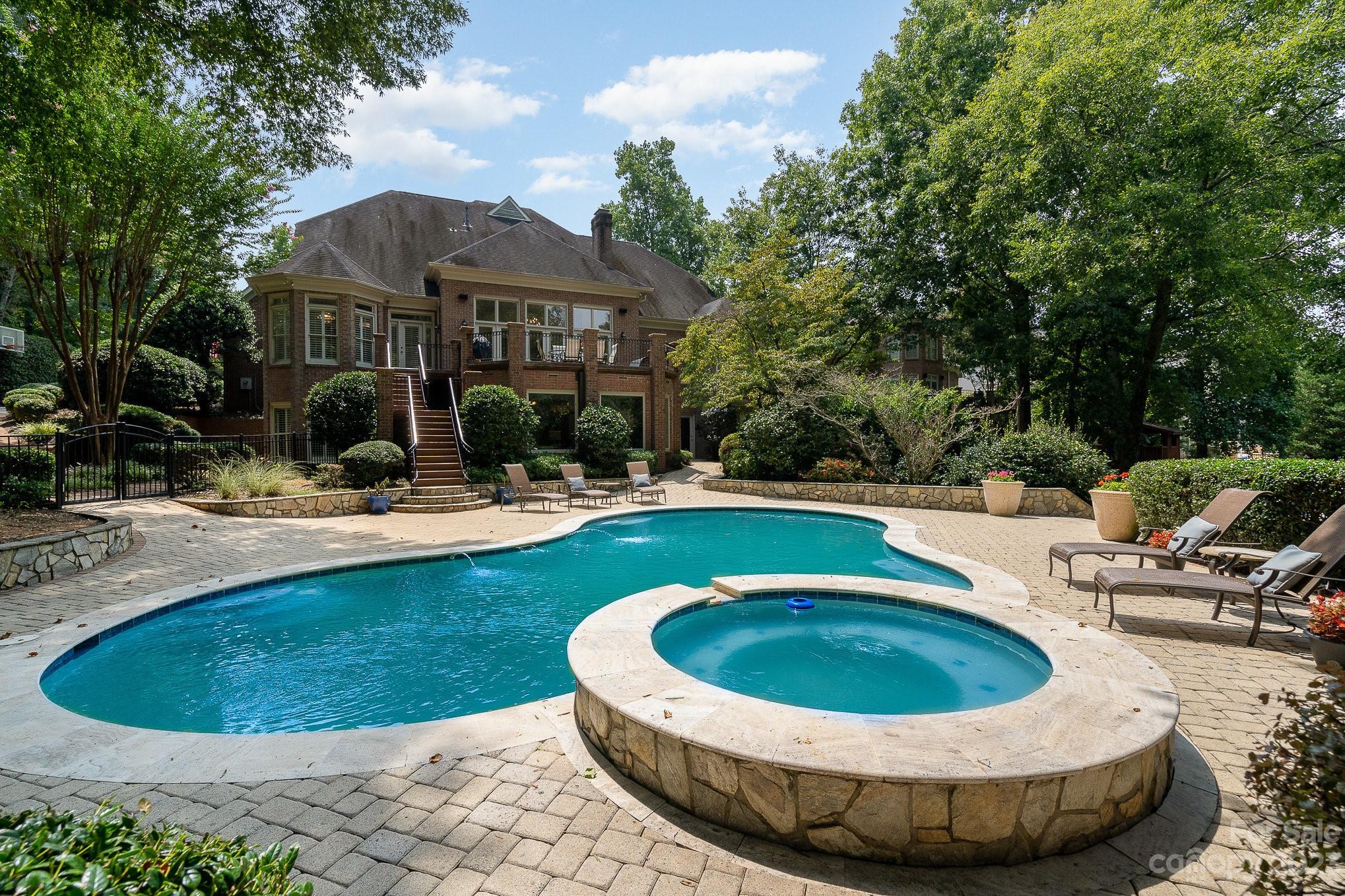 6535 Seton House Lane Charlotte, NC 28277 - Photo 44 of 48 a view of a swimming pool with a patio
