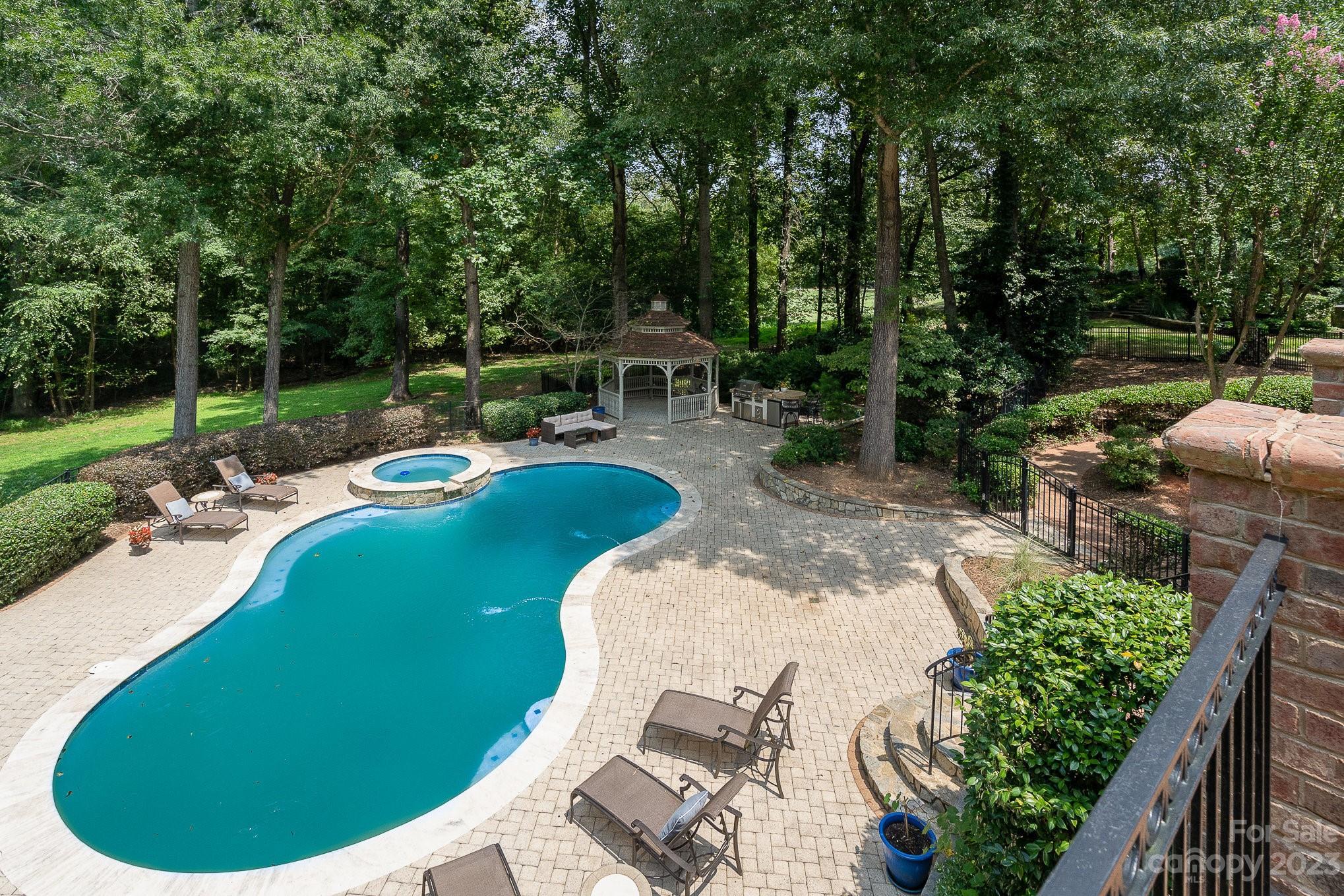 6535 Seton House Lane Charlotte, NC 28277 - Photo 45 of 48 a view of a backyard with sitting area
