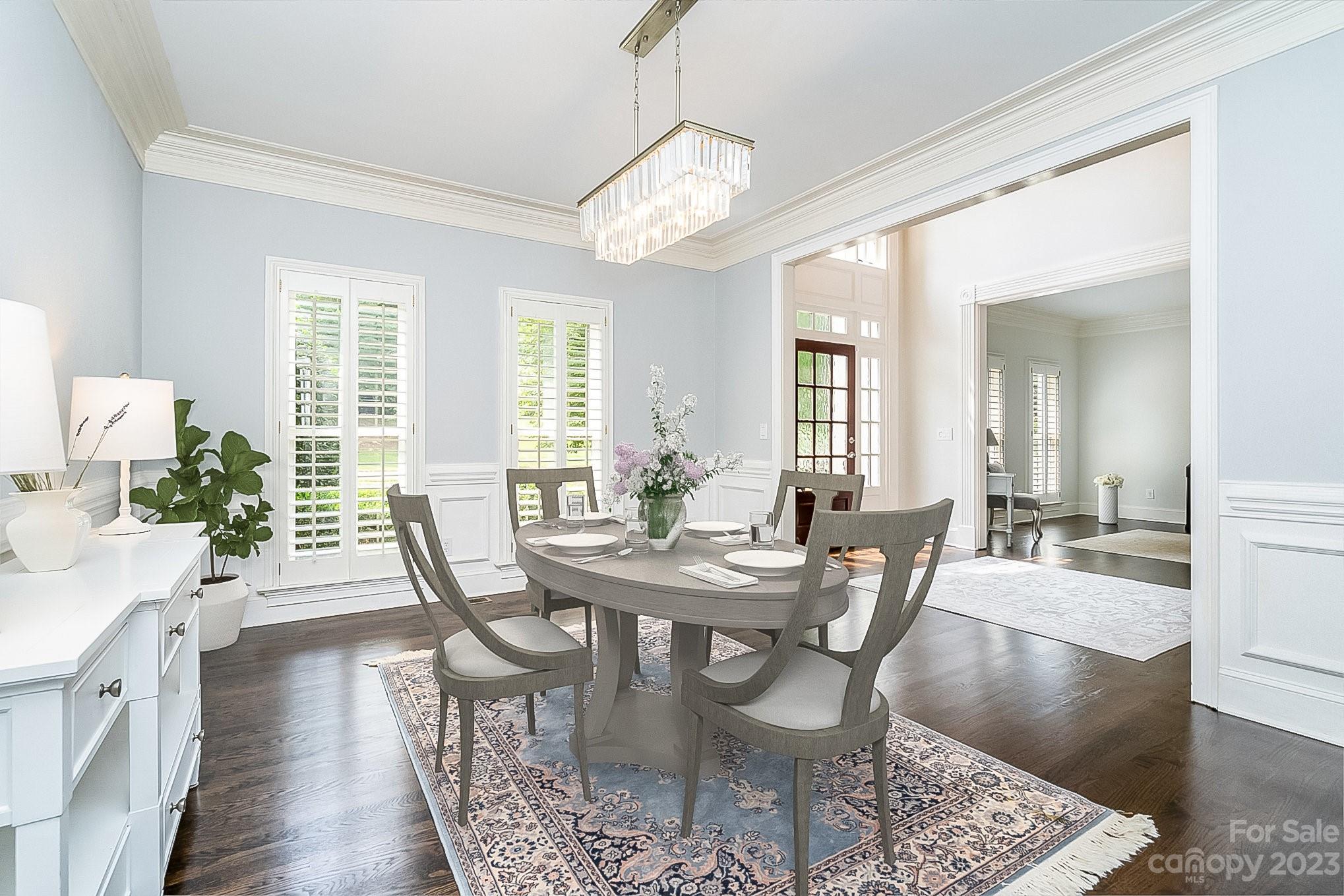 6535 Seton House Lane Charlotte, NC 28277 - Photo 6 of 48 a view of a dining room with furniture wooden floor and a chandelier