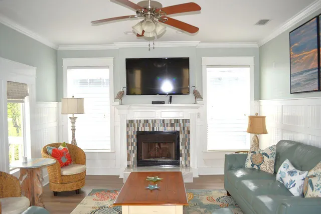a living room with furniture and a fireplace