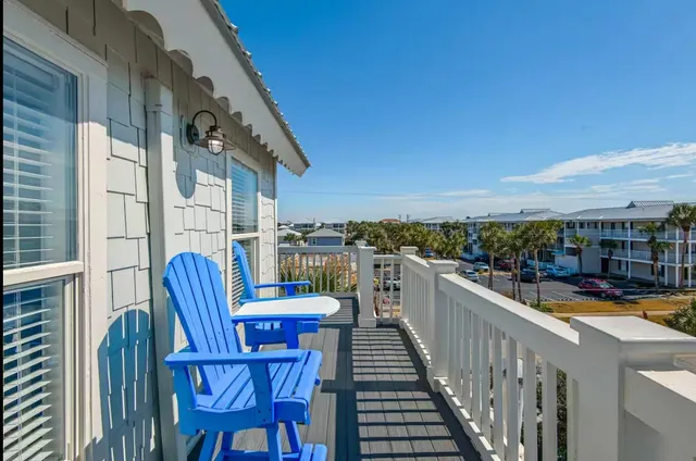a view of a balcony with furniture
