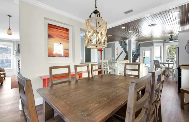 a dining room with furniture and window