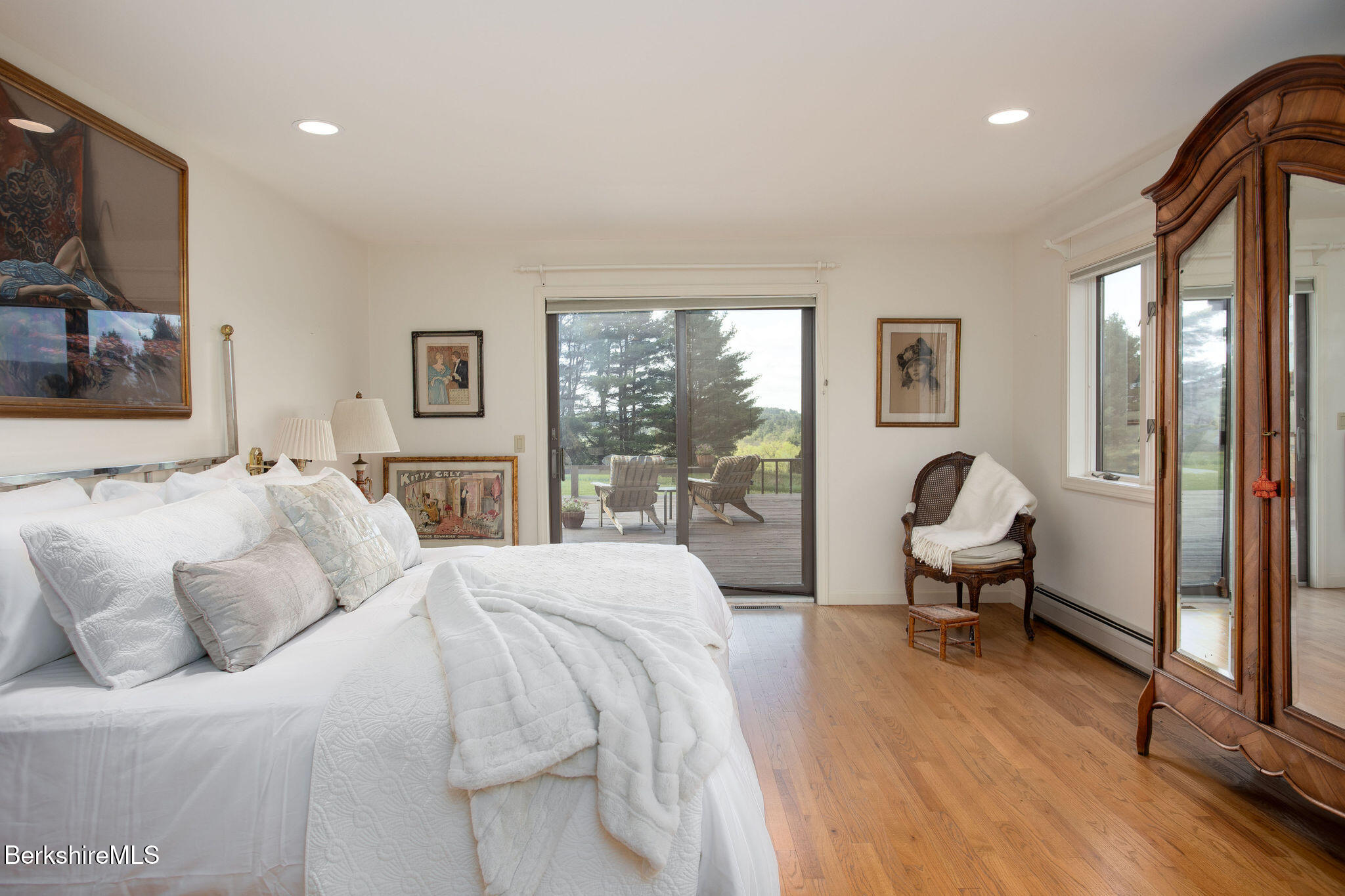77 Hurlburt Road Great Barrington, MA 01230 - Photo 25 of 48 a bedroom with a bed and large windows