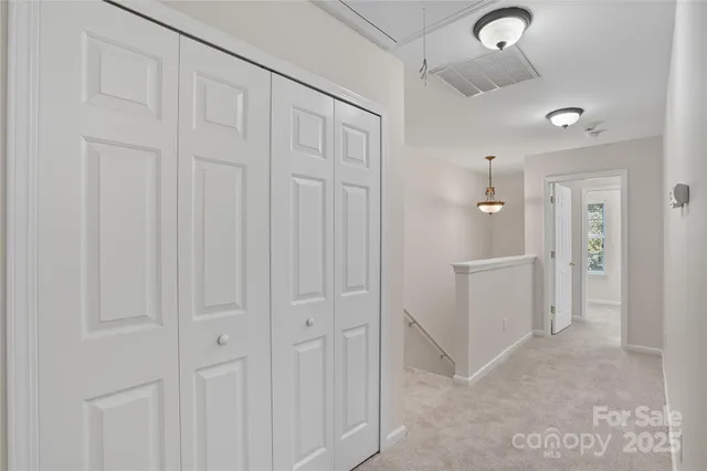 an empty room with kitchen space