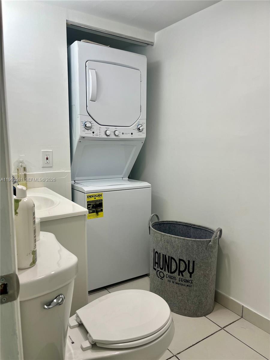 11800 Southwest 18th Street, Unit 3074 Miami, FL 33175 - Photo 13 of 14 a white toilet sitting next to a bathroom sink