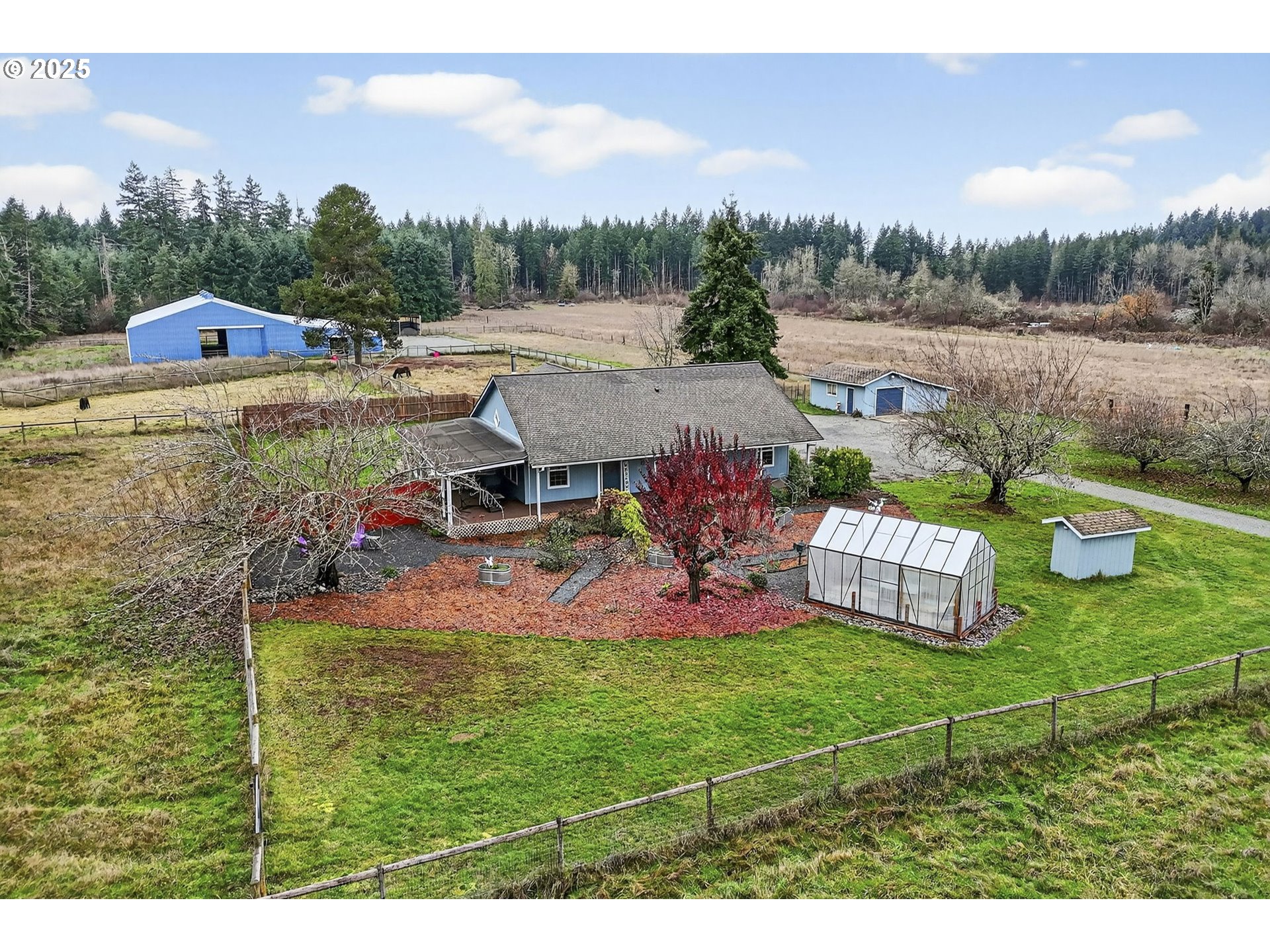 416 Coulson Road Chehalis, WA 98532 - Photo 1 of 46 a view of a table and chairs in the garden