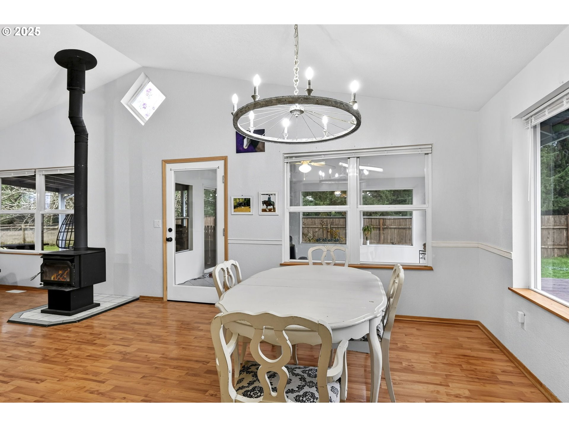 416 Coulson Road Chehalis, WA 98532 - Photo 25 of 46 a view of a dining room with furniture a chandelier and wooden floor