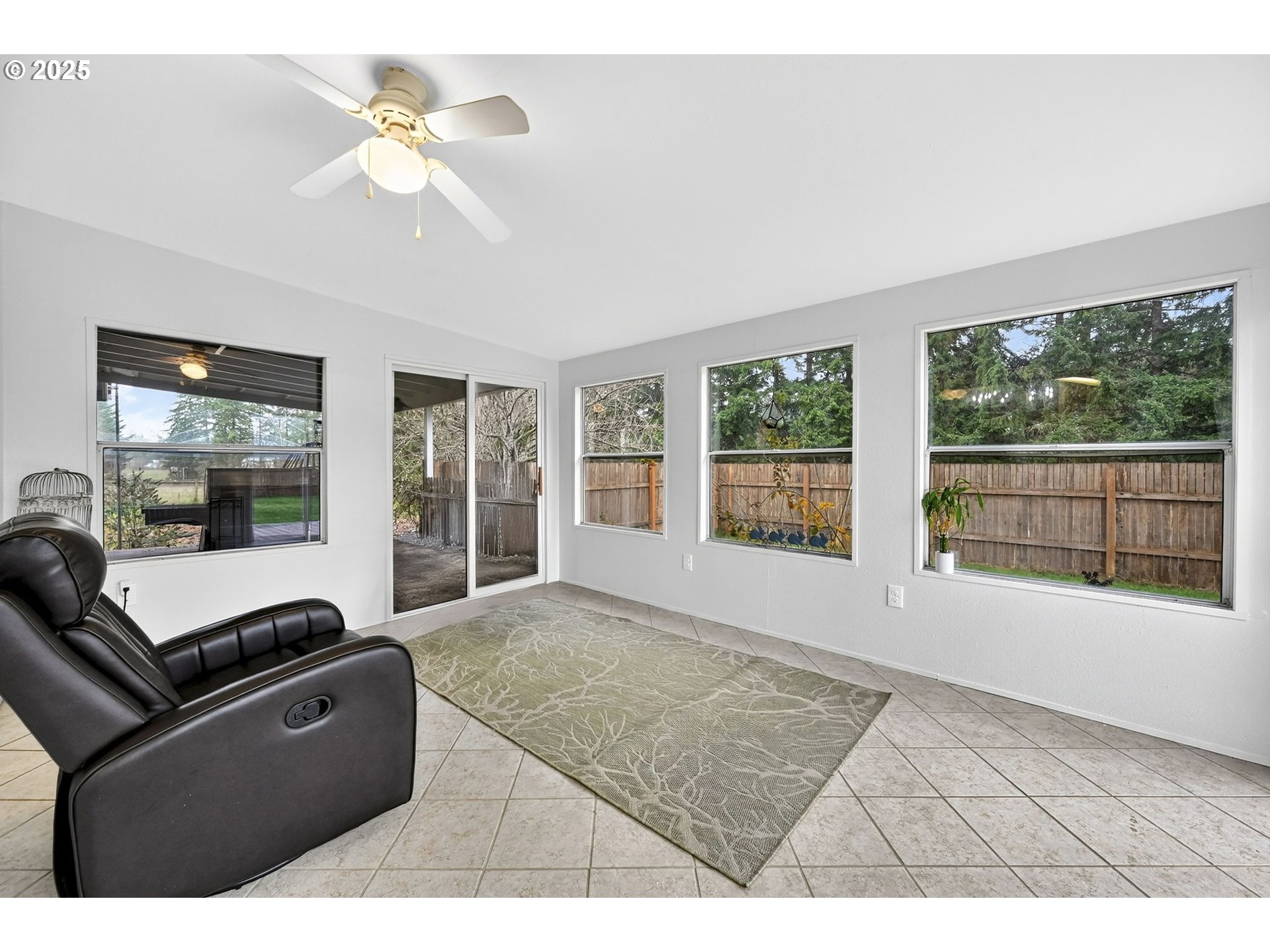 416 Coulson Road Chehalis, WA 98532 - Photo 30 of 46 a living room with furniture and a floor to ceiling window