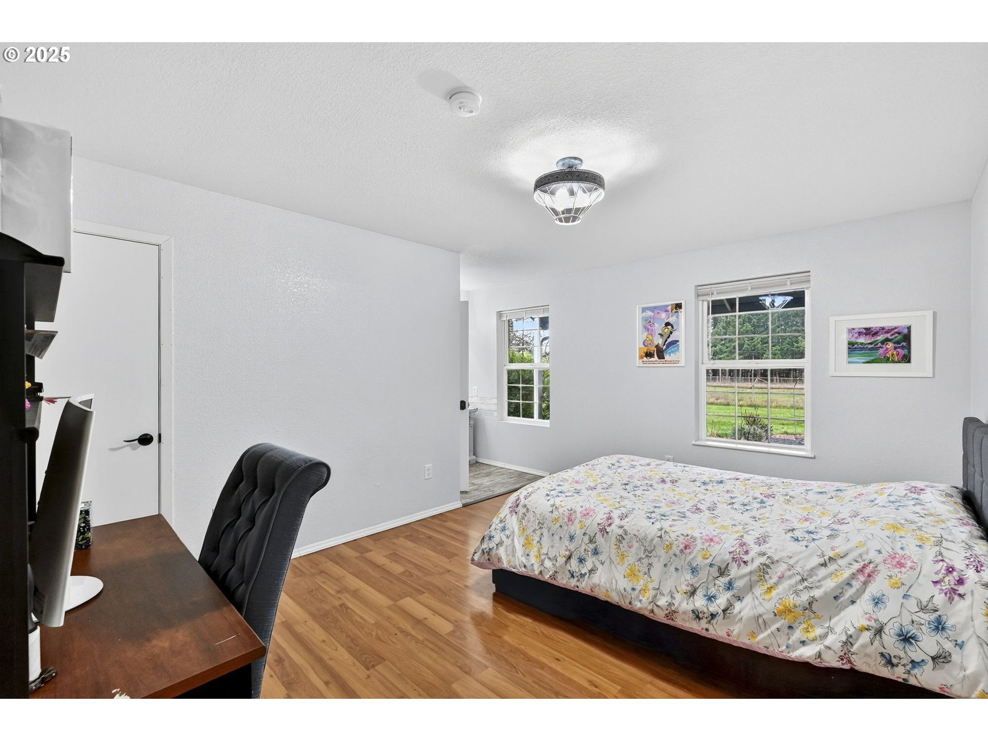 416 Coulson Road Chehalis, WA 98532 - Photo 31 of 46 a bedroom with a bed a dresser and a window