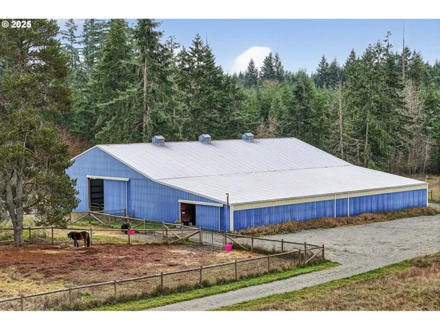 a aerial view of a house with a yard