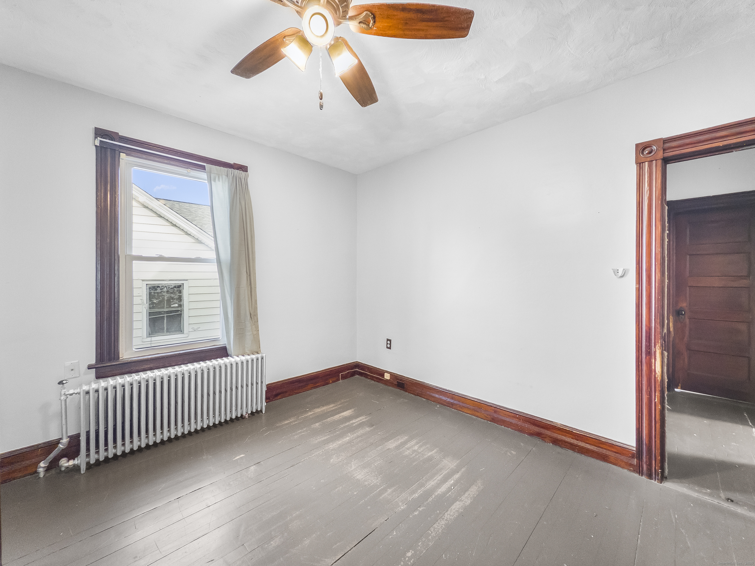 634 High Street, Unit 2 Middletown, CT 06457 - Photo 11 of 15 an empty room with chandelier fan and windows