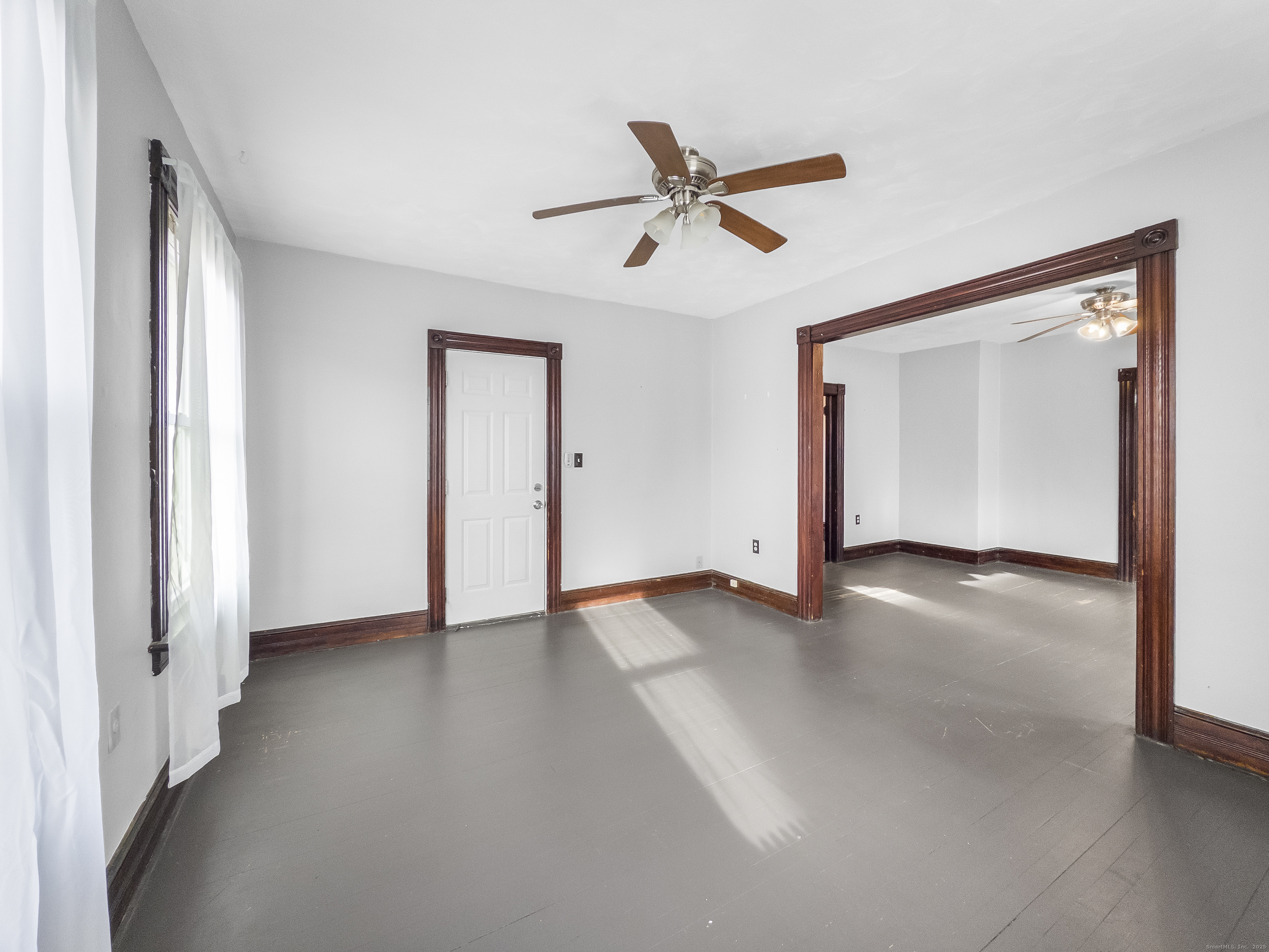 634 High Street, Unit 2 Middletown, CT 06457 - Photo 2 of 15 a view of a livingroom with a ceiling fan and window