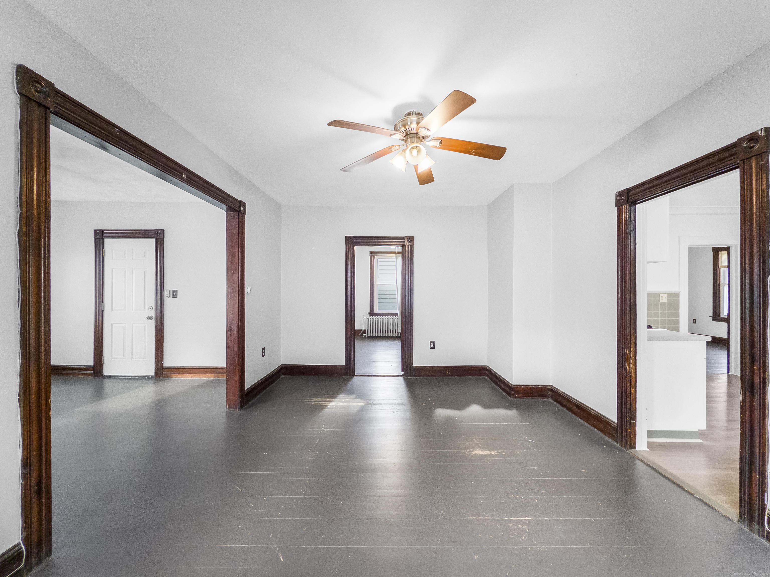 634 High Street, Unit 2 Middletown, CT 06457 - Photo 4 of 15 a view of an empty room with window and wooden floor