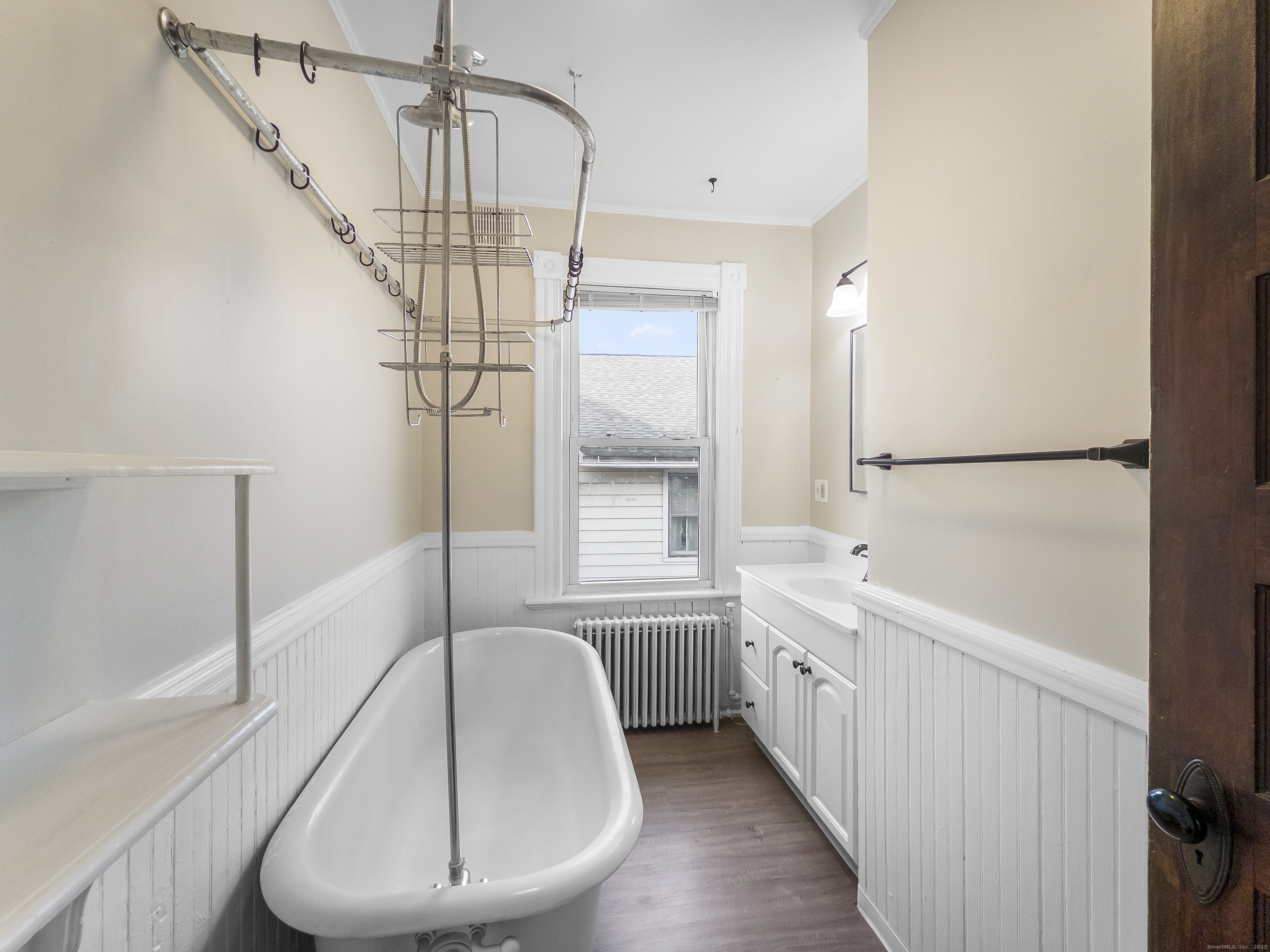 634 High Street, Unit 2 Middletown, CT 06457 - Photo 9 of 15 a bathroom with a sink a window and a mirror