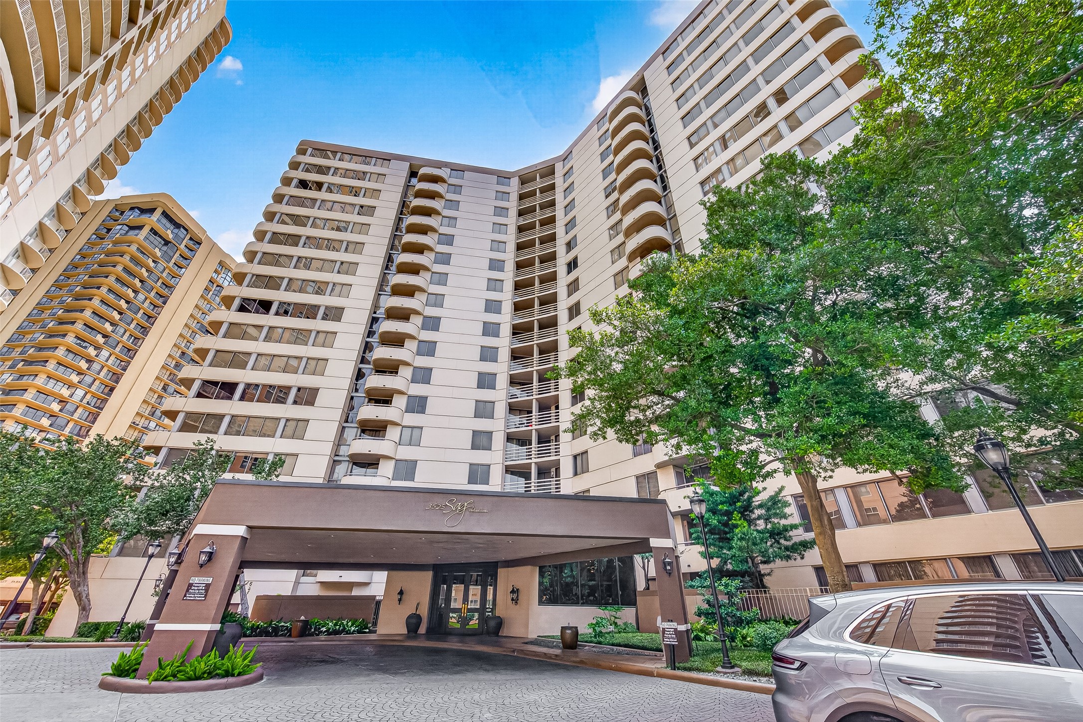 3525 Sage Road, Unit 1116 Houston, TX 77056 - Photo 1 of 25 High-rise condominium with beautifully landscaped circular drive and welcoming entrance.