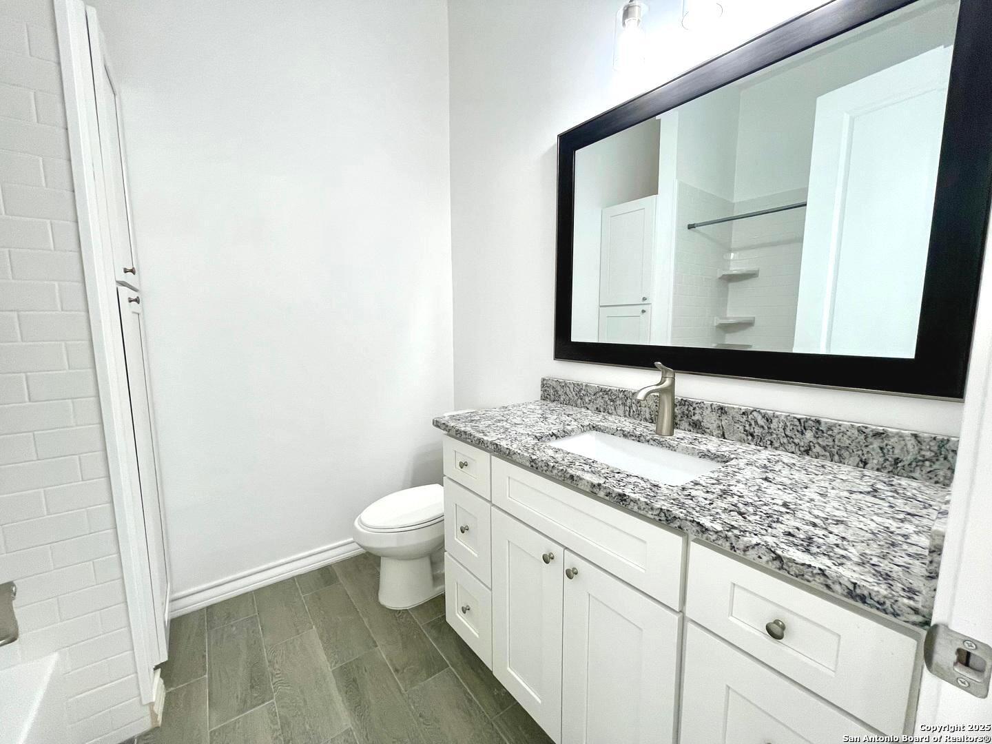 97 Berwick Road Victoria, TX 77904 - Photo 15 of 35 a bathroom with a granite countertop sink and a mirror