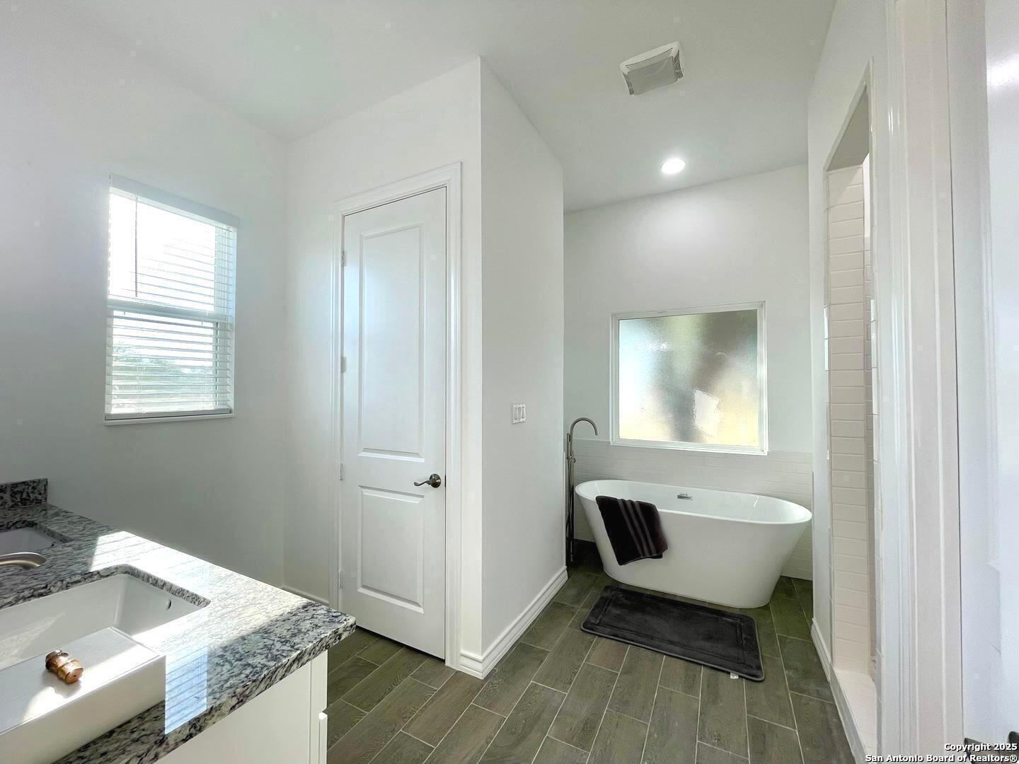 97 Berwick Road Victoria, TX 77904 - Photo 29 of 35 a hallway with a sink and a toilet
