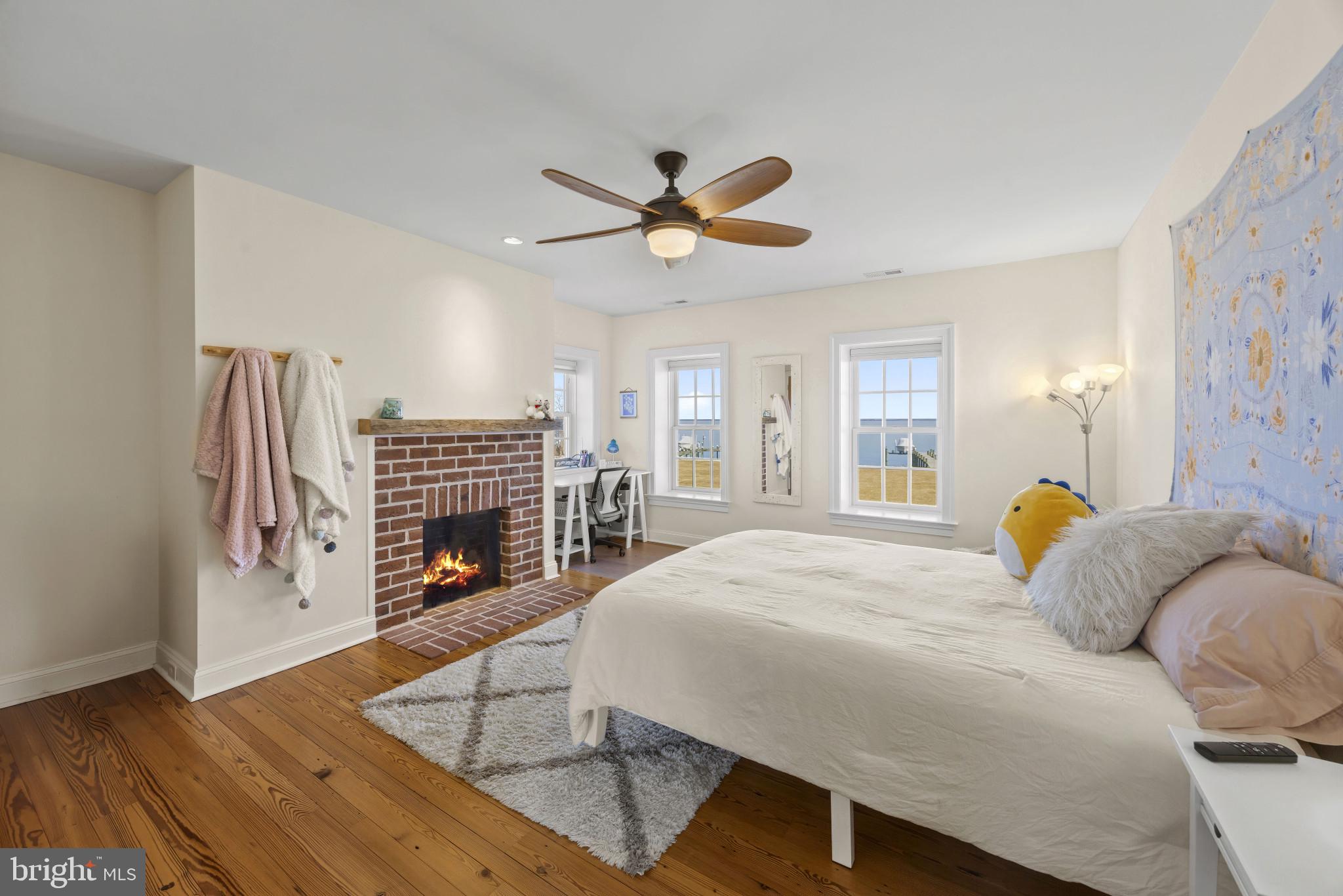 122 Queen Anne Road Stevensville, MD 21666 - Photo 29 of 39 Fireside bedroom with historic charm