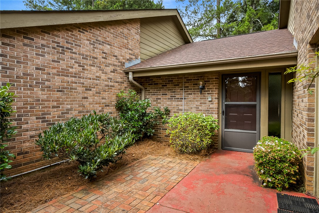 34 Hickory Way Clemson, SC 29631 - Photo 6 of 39 A welcoming brick facade with a patterned paver walkway leads to the main entrance.