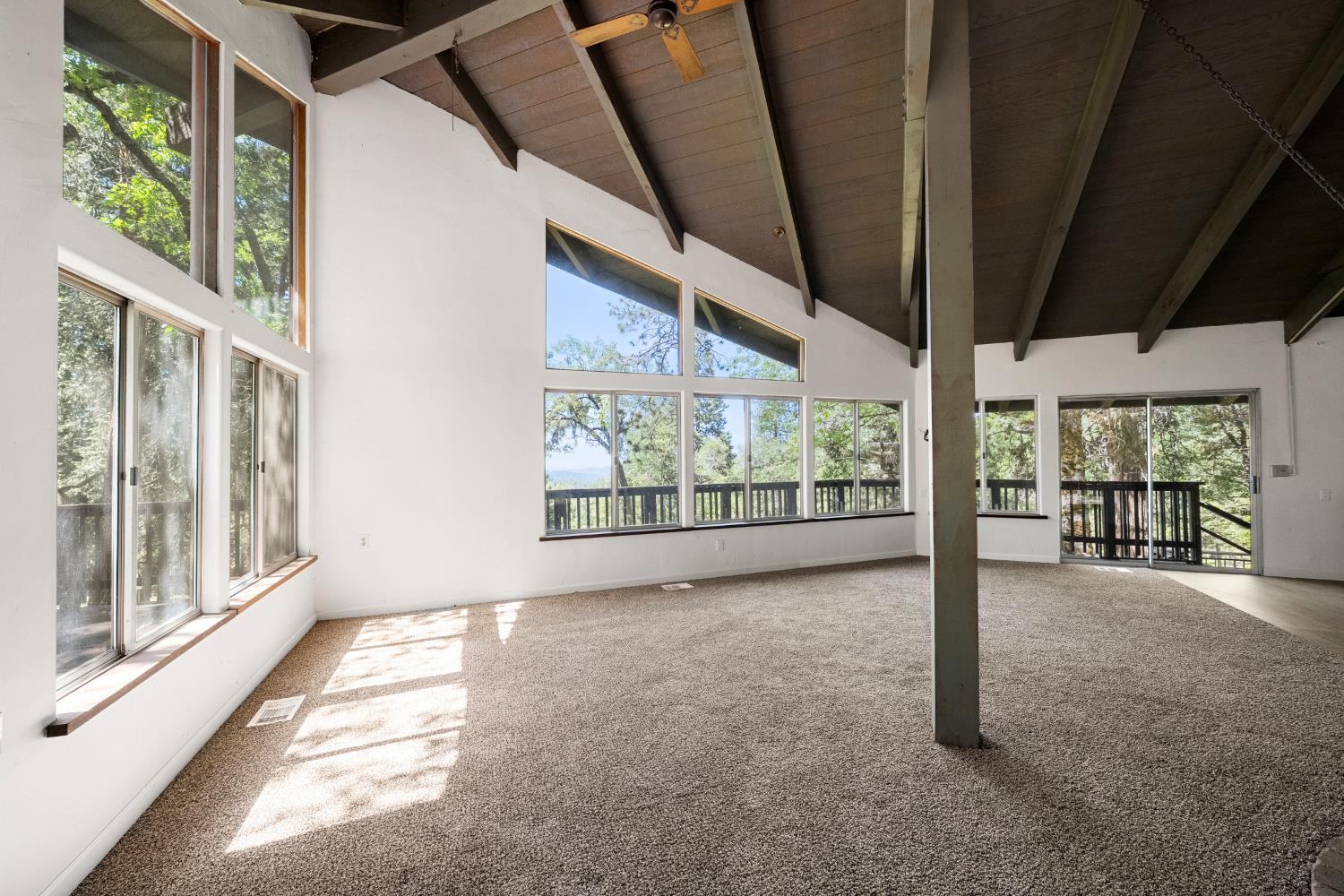 6420 Starkes Grade Road Pollock Pines, CA 95726 - Photo 13 of 58 a view of an empty room with a large window