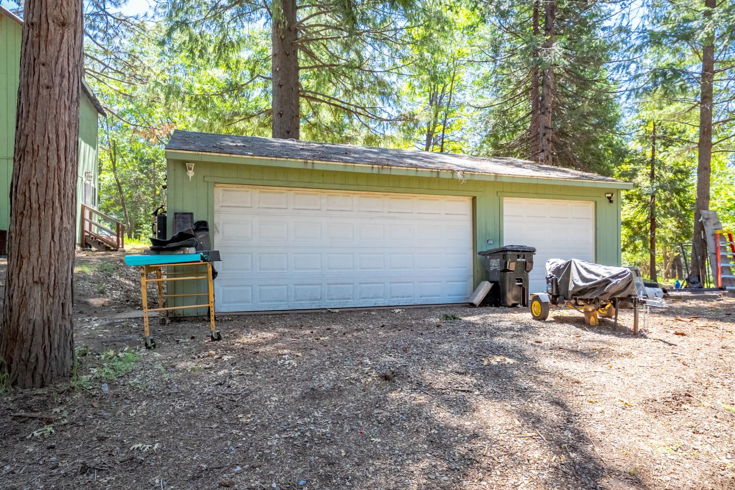 6420 Starkes Grade Road Pollock Pines, CA 95726 - Photo 18 of 58 a view of a chair and table in backyard of the house
