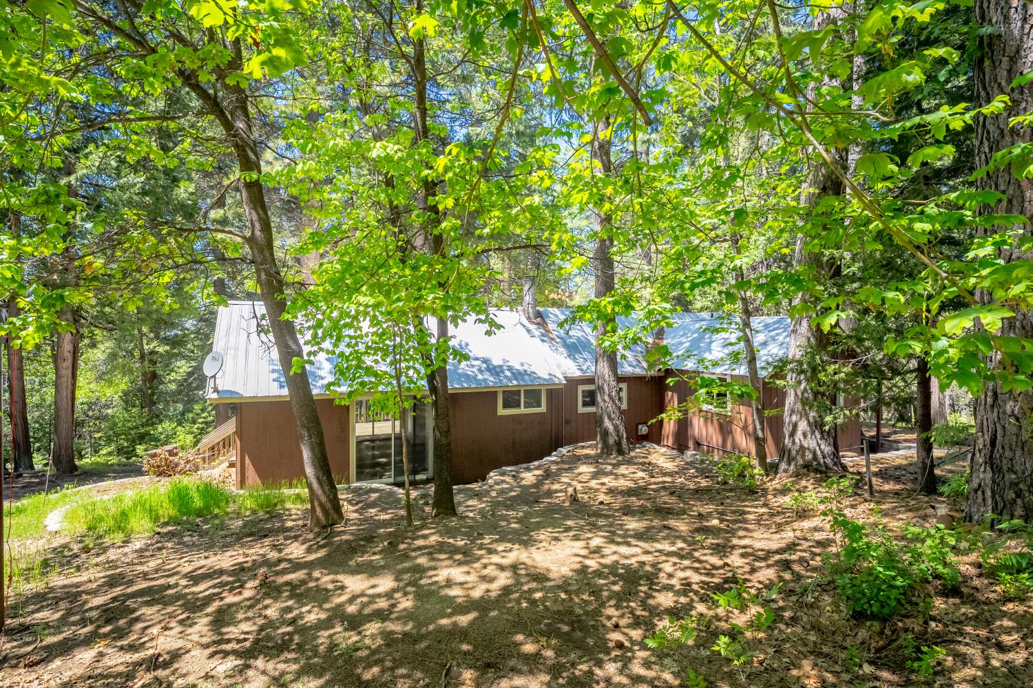 6420 Starkes Grade Road Pollock Pines, CA 95726 - Photo 23 of 58 a front view of a house with a yard and tree