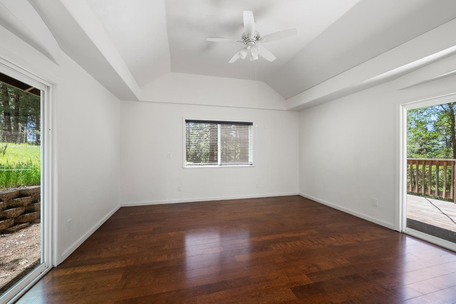6420 Starkes Grade Road Pollock Pines, CA 95726 - Photo 25 of 58 an empty room with wooden floor fan and windows
