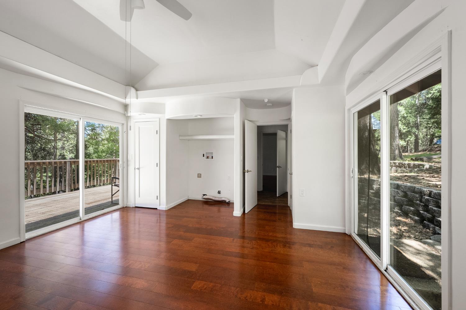 6420 Starkes Grade Road Pollock Pines, CA 95726 - Photo 26 of 58 an empty room with wooden floor and windows