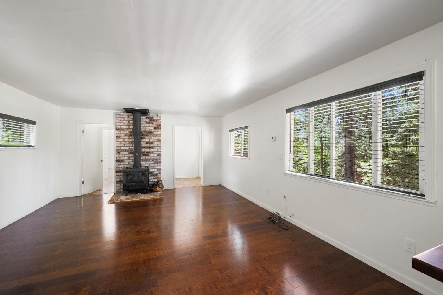 6420 Starkes Grade Road Pollock Pines, CA 95726 - Photo 28 of 58 a view of an empty room with wooden floor and a window