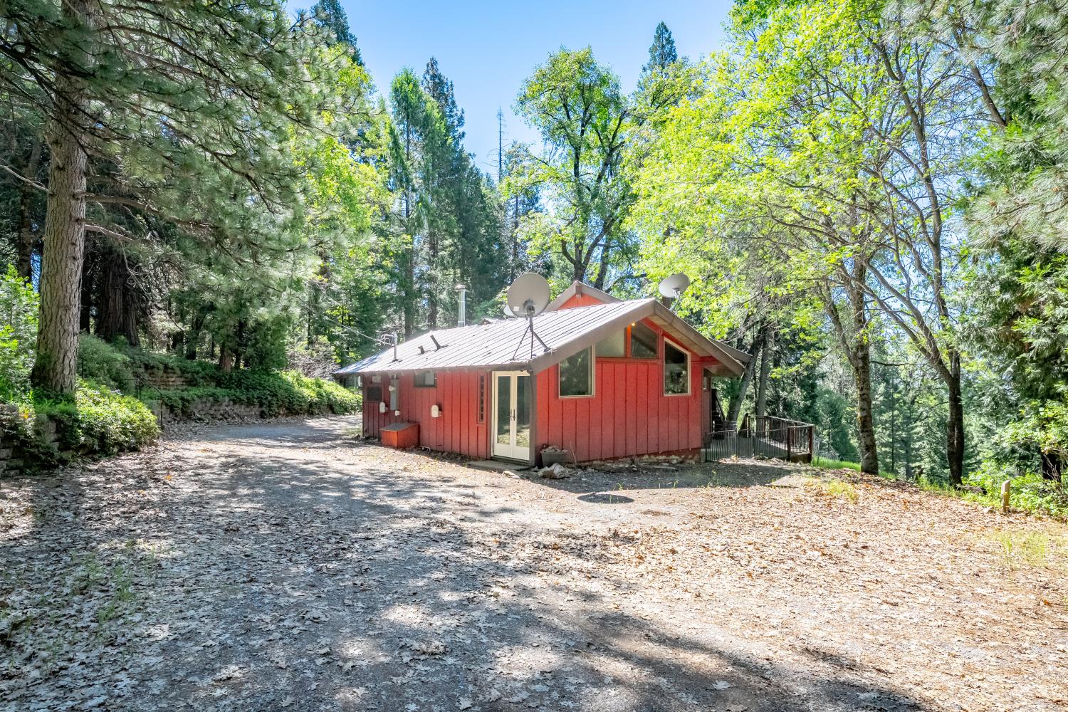 6420 Starkes Grade Road Pollock Pines, CA 95726 - Photo 3 of 58 a view of backyard with large trees and wooden fence
