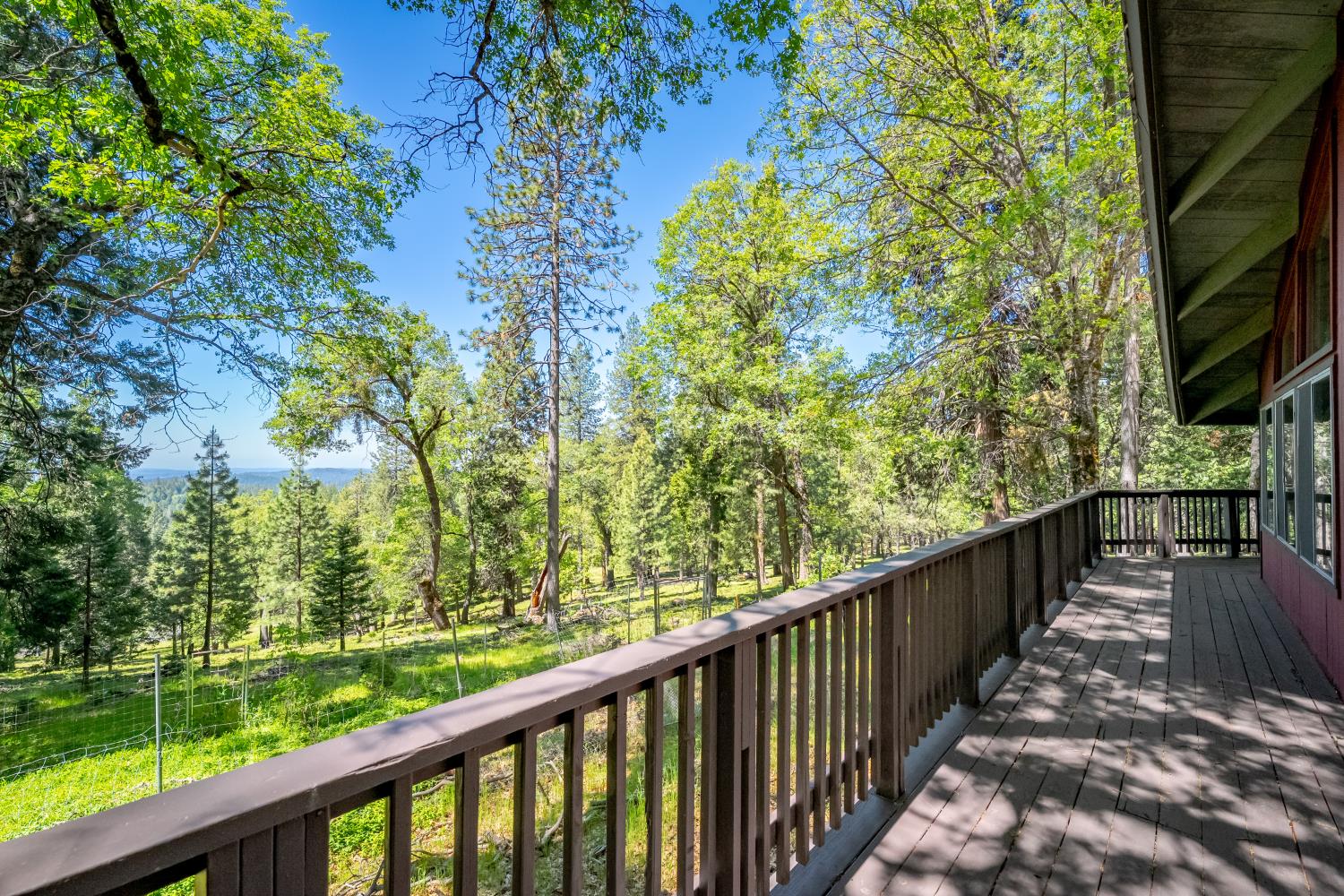 6420 Starkes Grade Road Pollock Pines, CA 95726 - Photo 7 of 58 a view of balcony with wooden floor and fence
