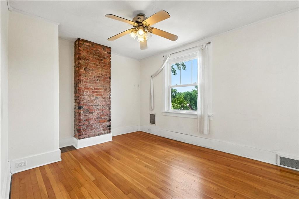 5248 Beelermont Place Pittsburgh, PA 15217 - Photo 20 of 36 wooden floor in an empty room with a window
