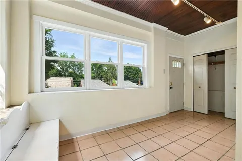 a view of empty room with windows