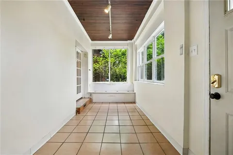 a picture of a bench in front of a building