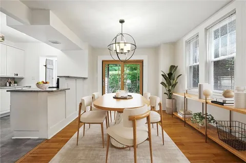 a view of a dining room with furniture window and outside view