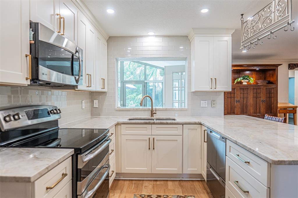 741 Brookside Road Maitland, FL 32751 - Photo 6 of 43 a kitchen with a sink stove and cabinets
