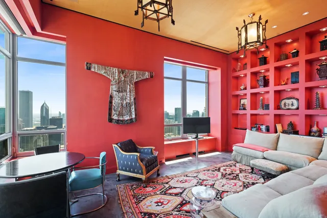 a bedroom with a large bed and a large window