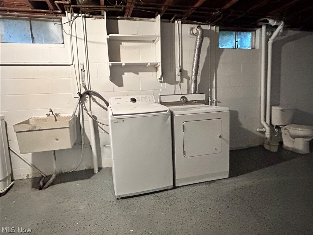 443 Lansing Road Akron, OH 44312 - Photo 25 of 29 Laundry area in basement with additional toilet