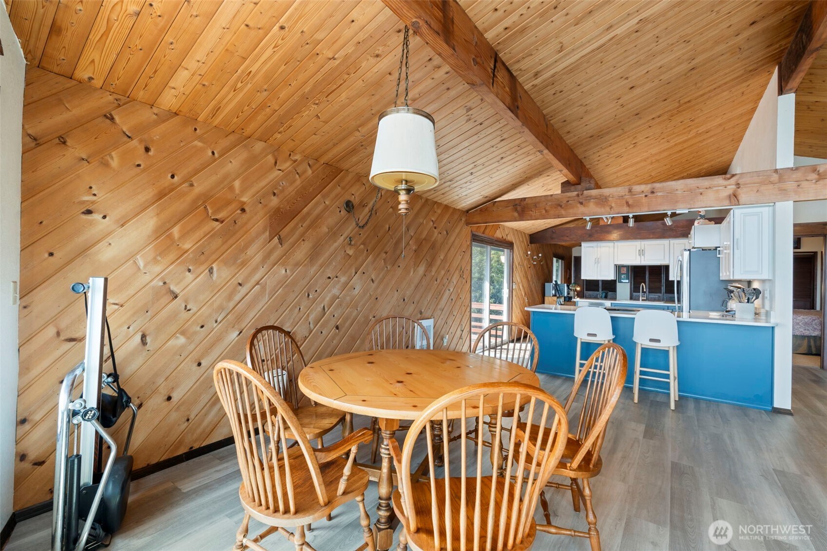 326 Harbor View Loop Southeast Ocean Shores, WA 98569 - Photo 11 of 38 a dining room with furniture and a chandelier