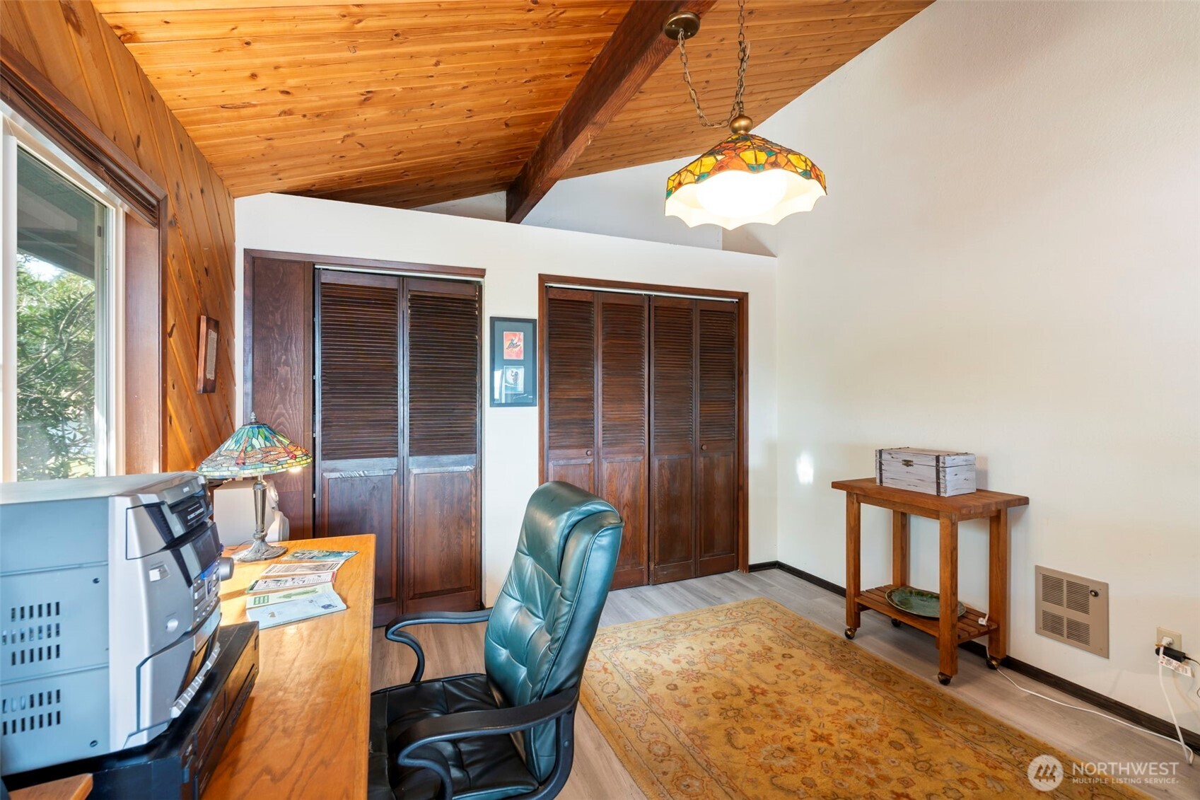 326 Harbor View Loop Southeast Ocean Shores, WA 98569 - Photo 13 of 38 a view of a dining room with furniture and a window