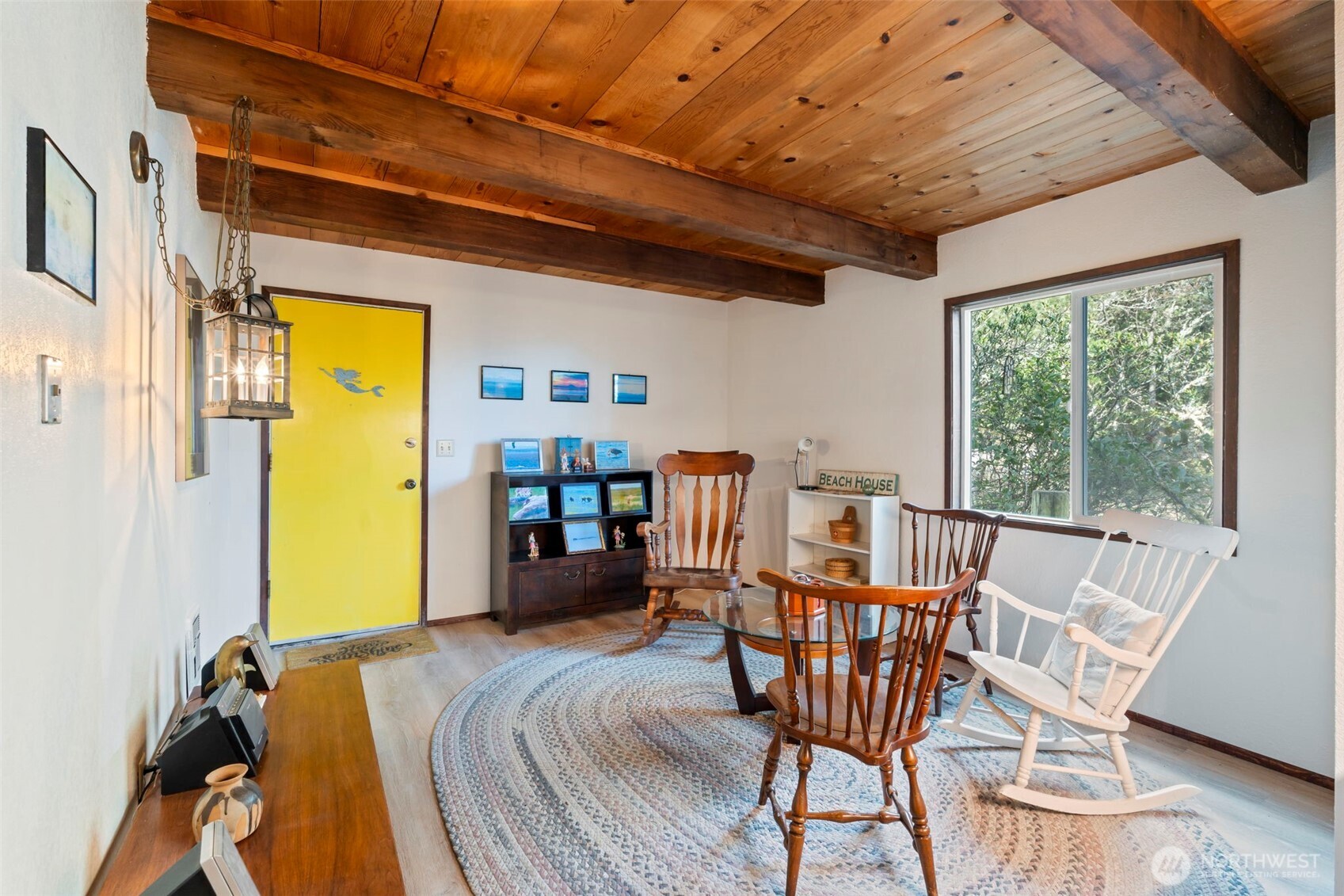 326 Harbor View Loop Southeast Ocean Shores, WA 98569 - Photo 16 of 38 a view of a dining room with furniture window and wooden floor