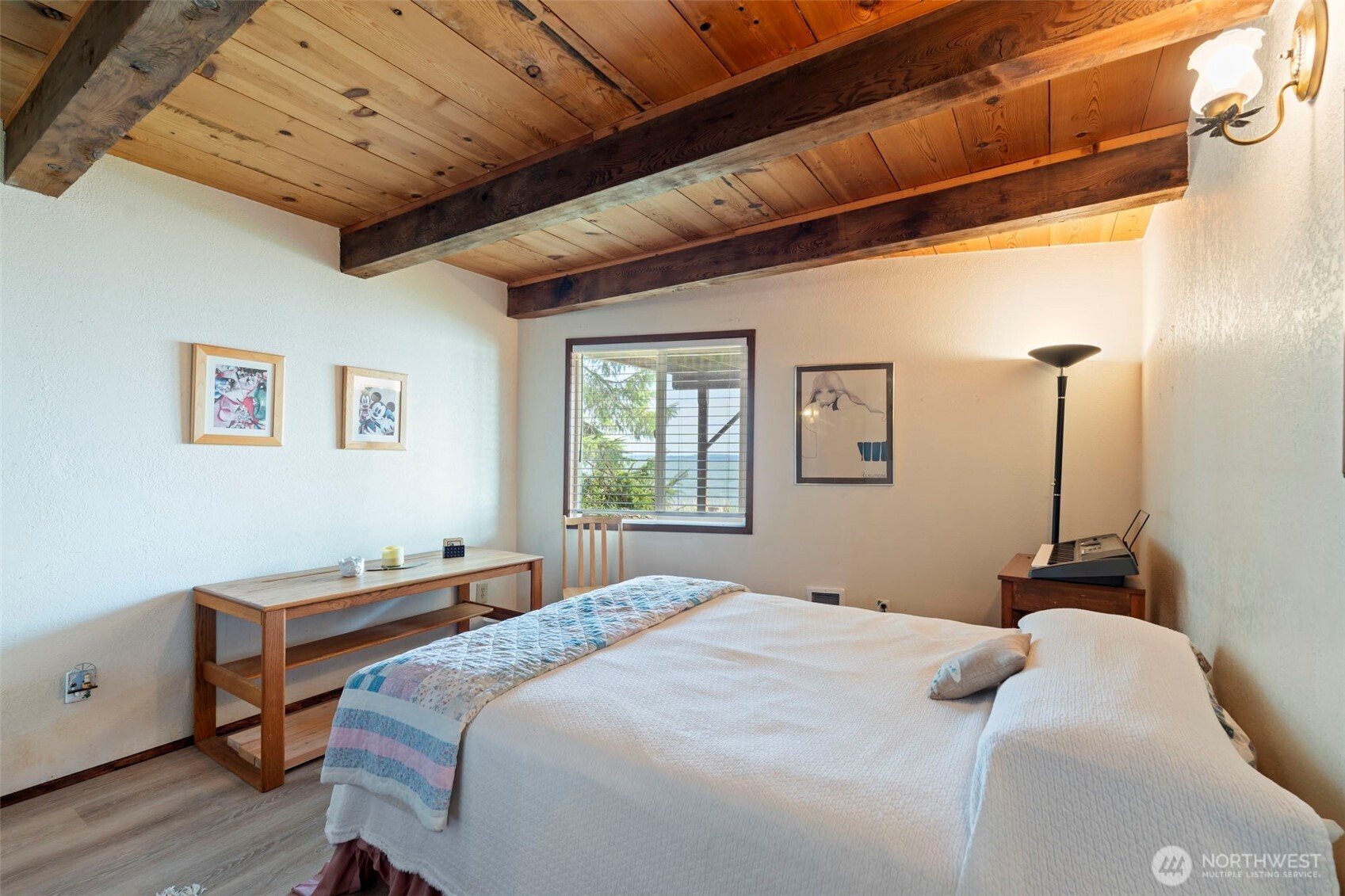 326 Harbor View Loop Southeast Ocean Shores, WA 98569 - Photo 18 of 38 a bedroom with a bed and a window