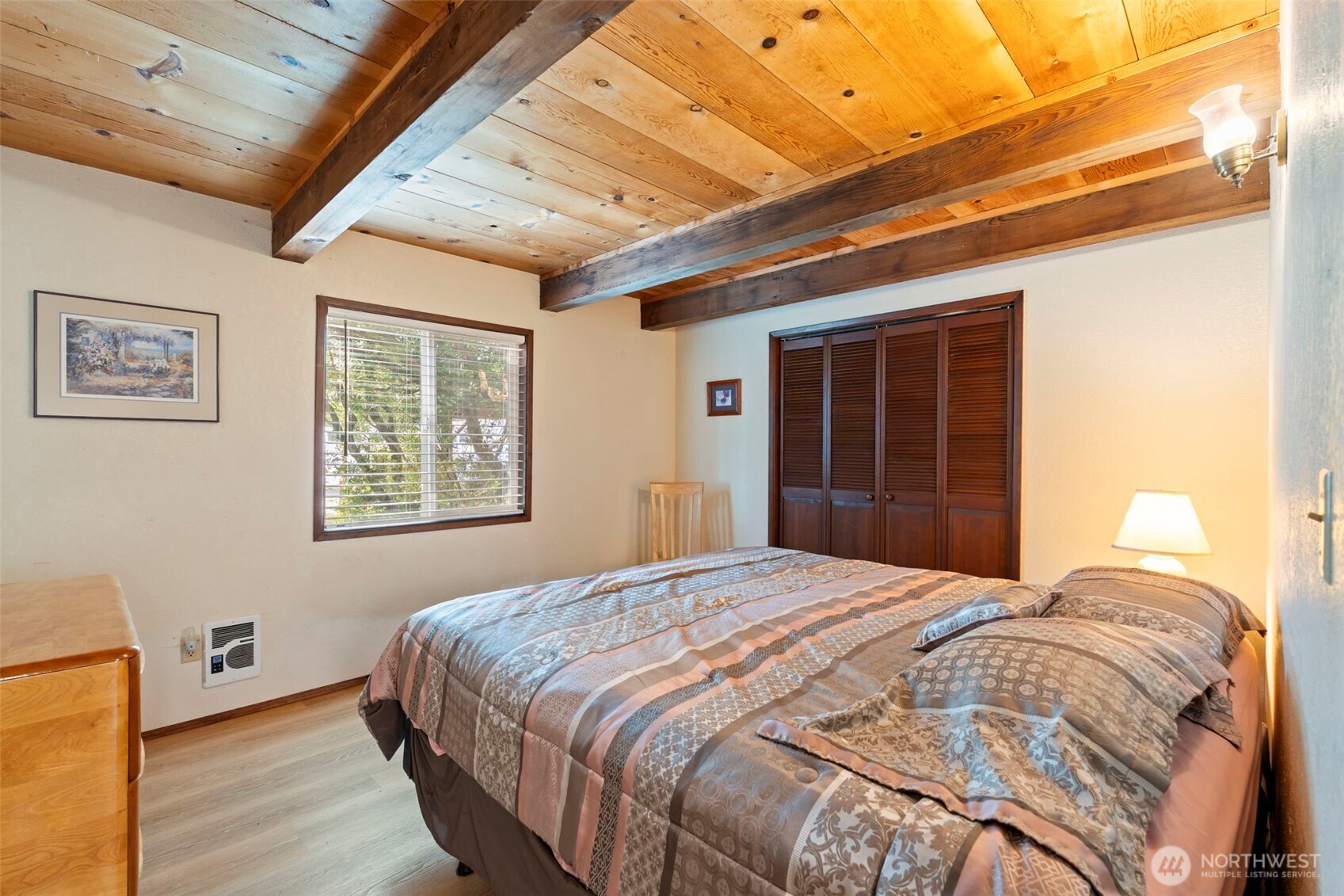 326 Harbor View Loop Southeast Ocean Shores, WA 98569 - Photo 19 of 38 a bedroom with a bed and a window