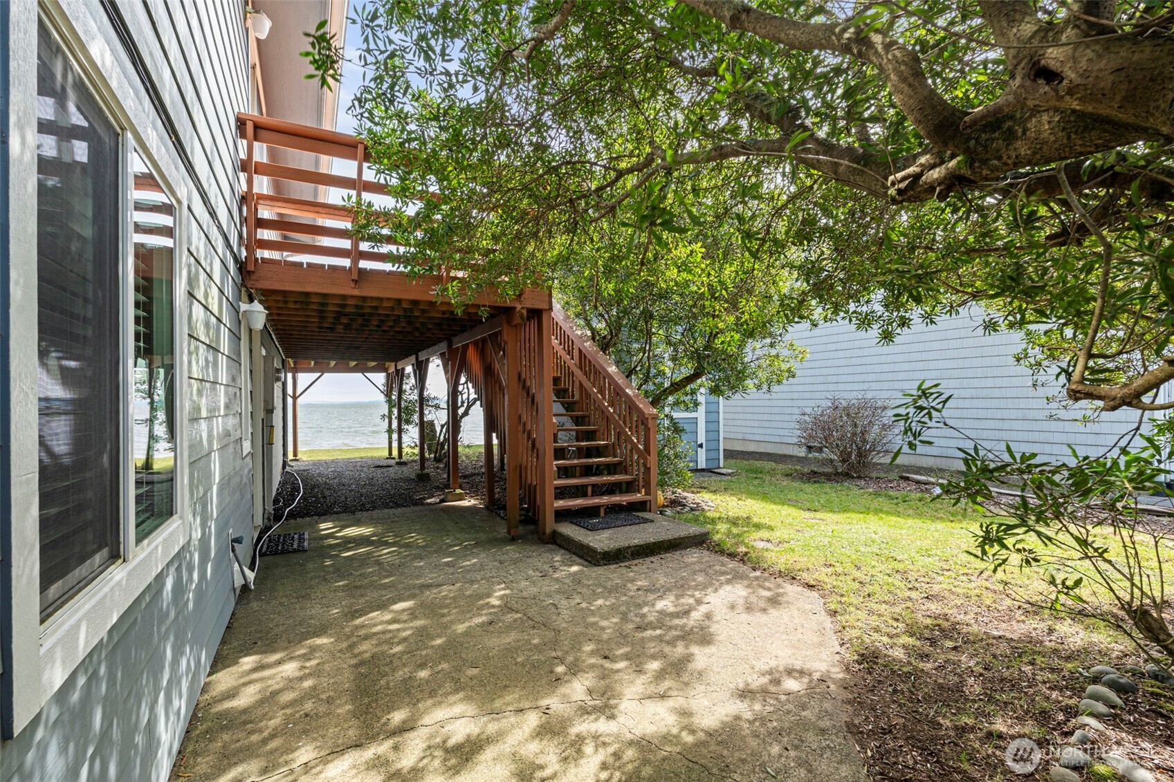 326 Harbor View Loop Southeast Ocean Shores, WA 98569 - Photo 23 of 38 a view of a house with a yard