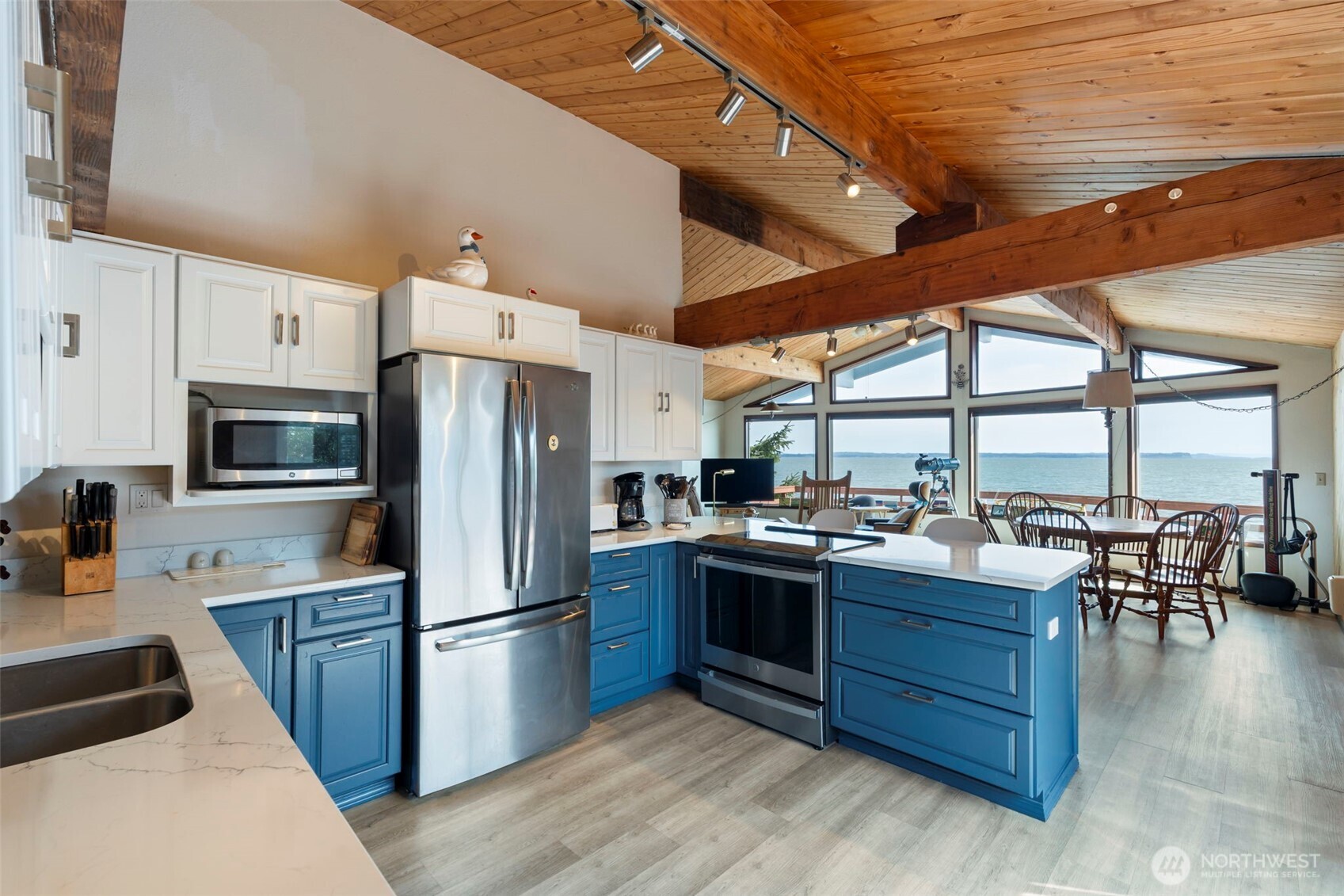 326 Harbor View Loop Southeast Ocean Shores, WA 98569 - Photo 3 of 38 a kitchen with stainless steel appliances granite countertop a stove and refrigerator