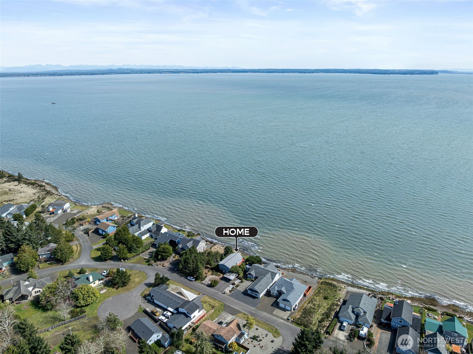 326 Harbor View Loop Southeast Ocean Shores, WA 98569 - Photo 32 of 38 a view of a terrace with wooden floor