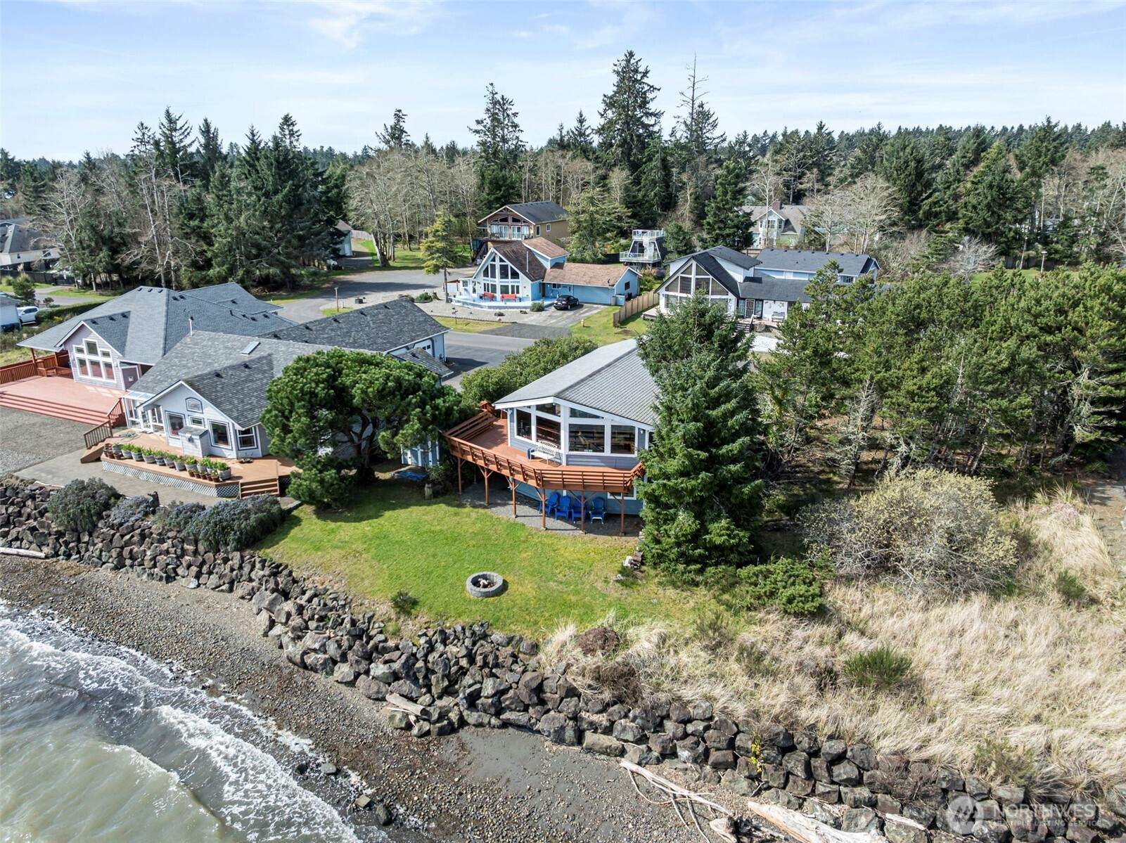 326 Harbor View Loop Southeast Ocean Shores, WA 98569 - Photo 35 of 38 a front view of a house with garden